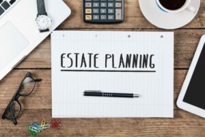 Notepad with "ESTATE PLAN" written on it.